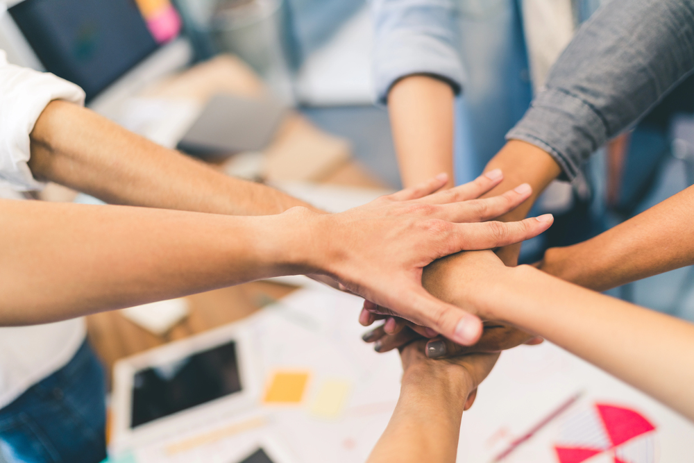 Small community group meeting supported by local charity funding